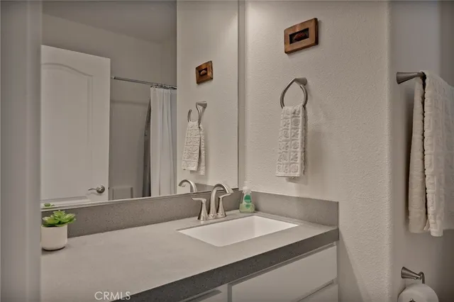 a bathroom with a toilet and a window