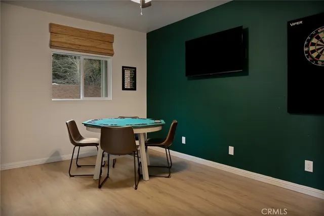 a view of a dining room with furniture and a window