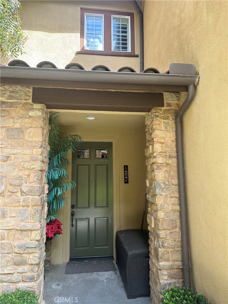 213 Danbrook Irvine, CA 92603 - Photo 2 of 5 a front view of a house with a garden