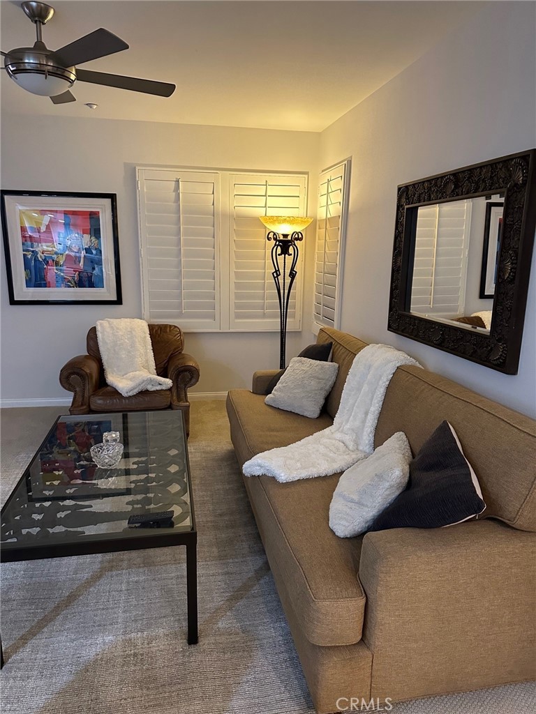 213 Danbrook Irvine, CA 92603 - Photo 5 of 5 a living room with furniture and a flat screen tv