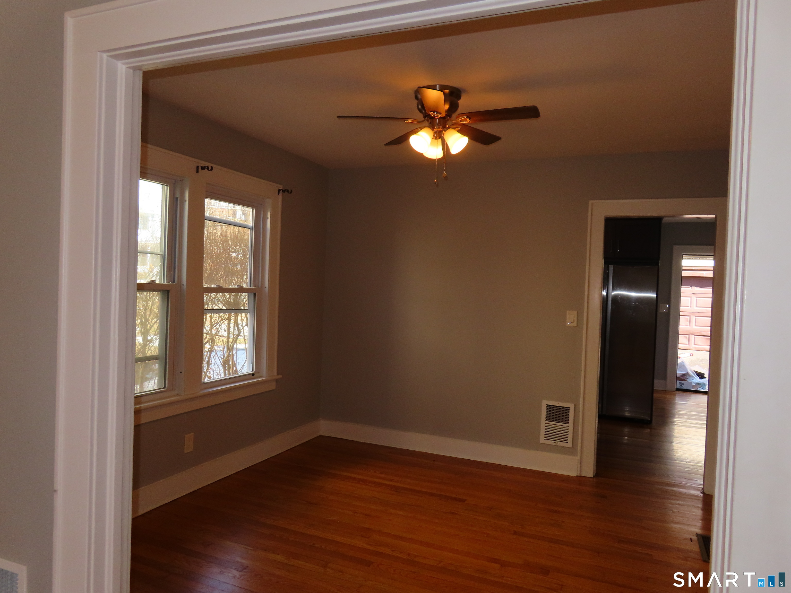 40 Winter Street Ansonia, CT 06401 - Photo 1 of 24 a view of empty room with wooden floor and fan