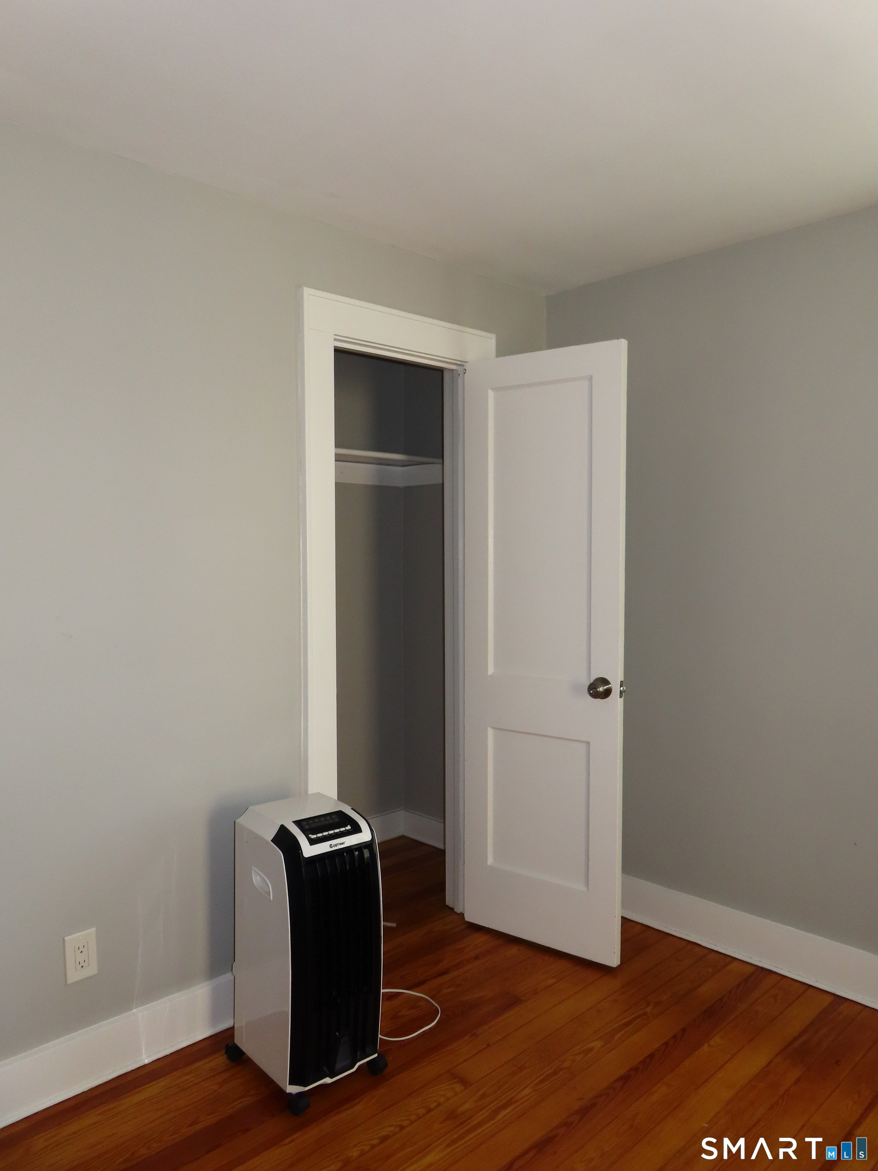 40 Winter Street Ansonia, CT 06401 - Photo 14 of 24 an empty room with wooden floor and closet