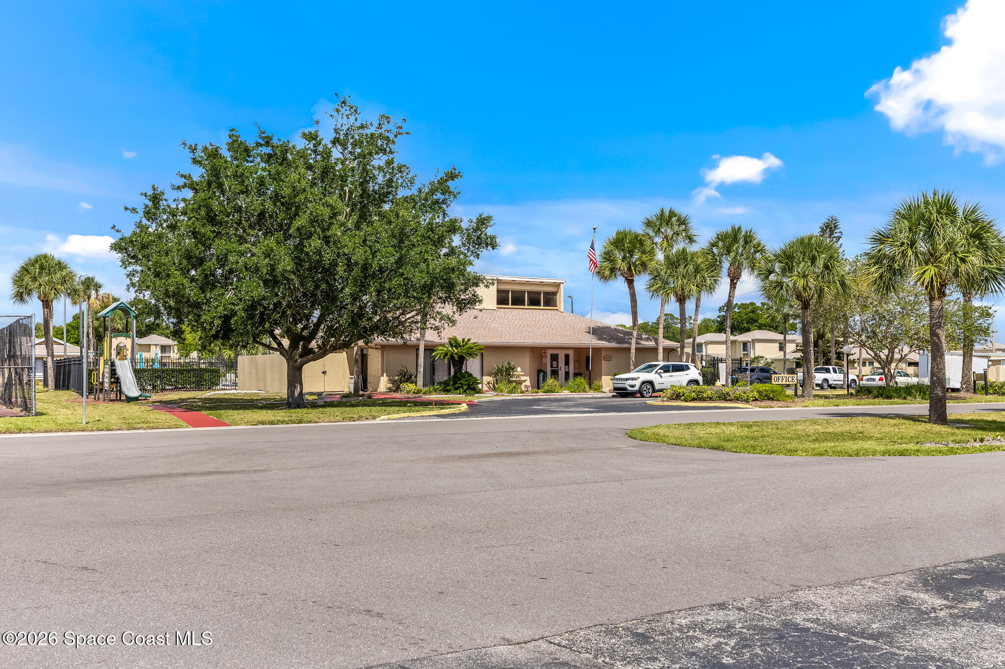 1411 Sheafe Avenue Northeast, Unit 101 Palm Bay, FL 32905 - Photo 23 of 24 a view of a swimming pool and a yard