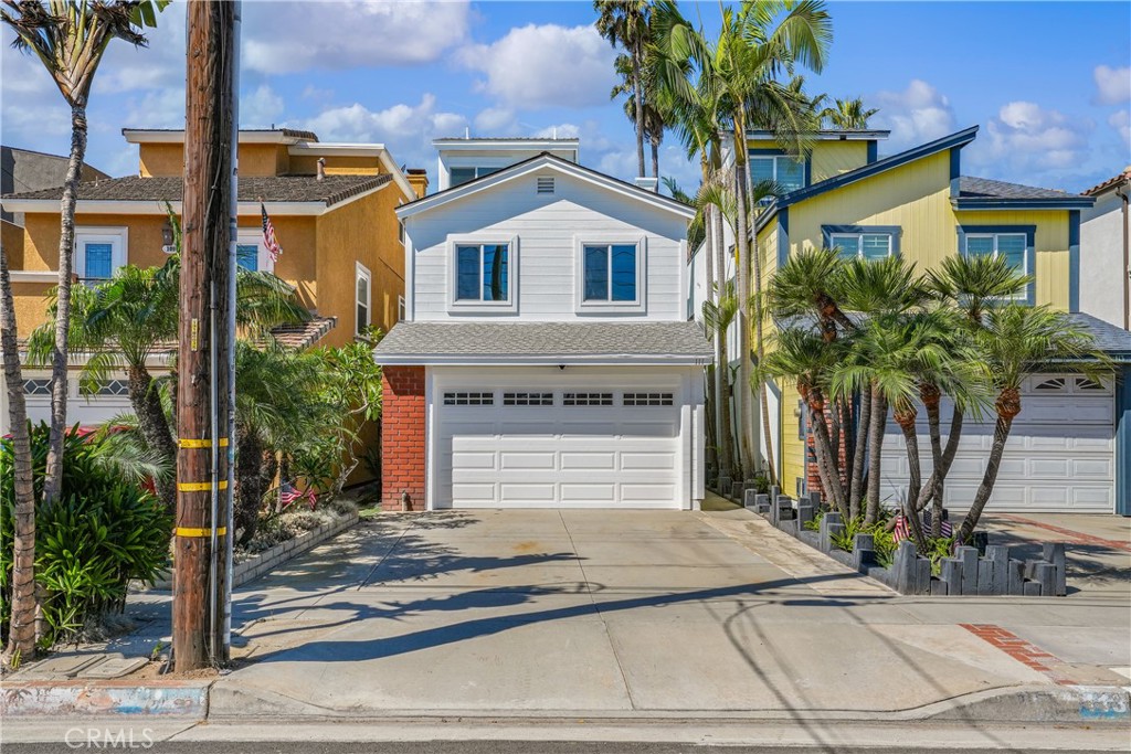 111 Alabama Street Huntington Beach, CA 92648 - Photo 6 of 50 a front view of a house with a yard and garage