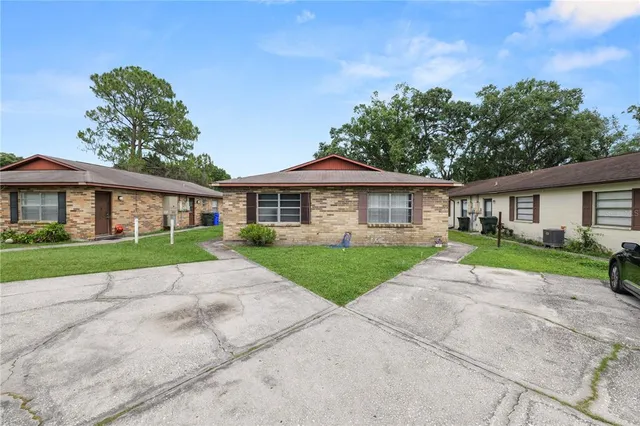 front view of a house next to a yard