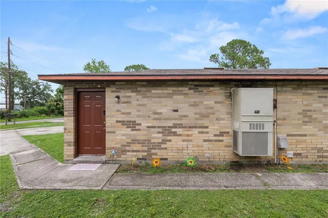 a view of a backyard with a sink and plants