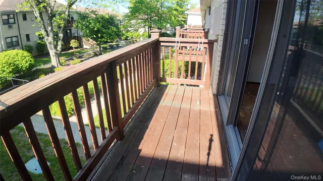 a view of balcony with wooden floor
