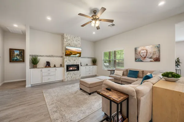 a living room with furniture and a fireplace