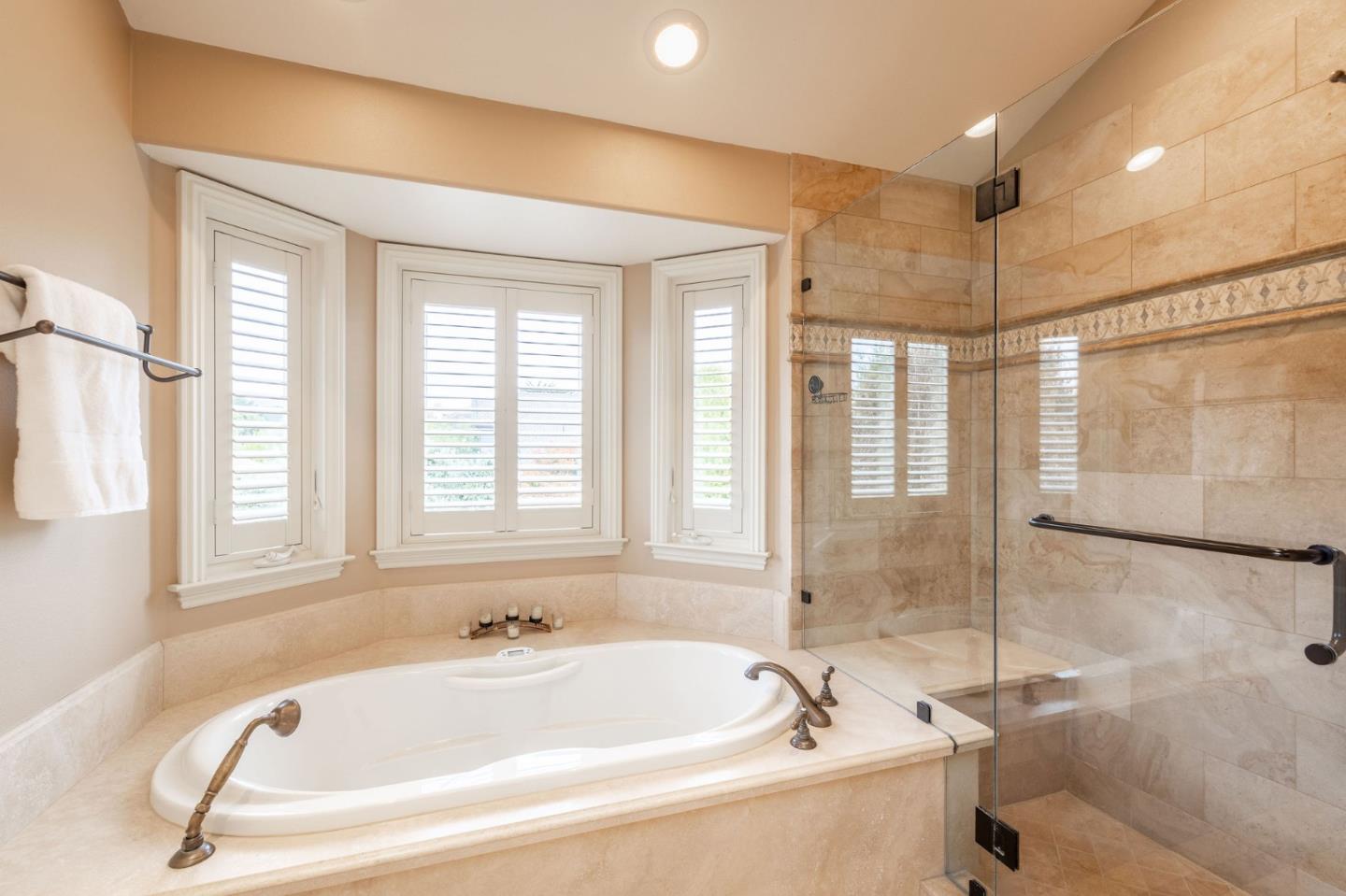 2107 Winged Foot Road Half Moon Bay, CA 94019 - Photo 15 of 29 a white bath tub sitting in a bathroom next to a window