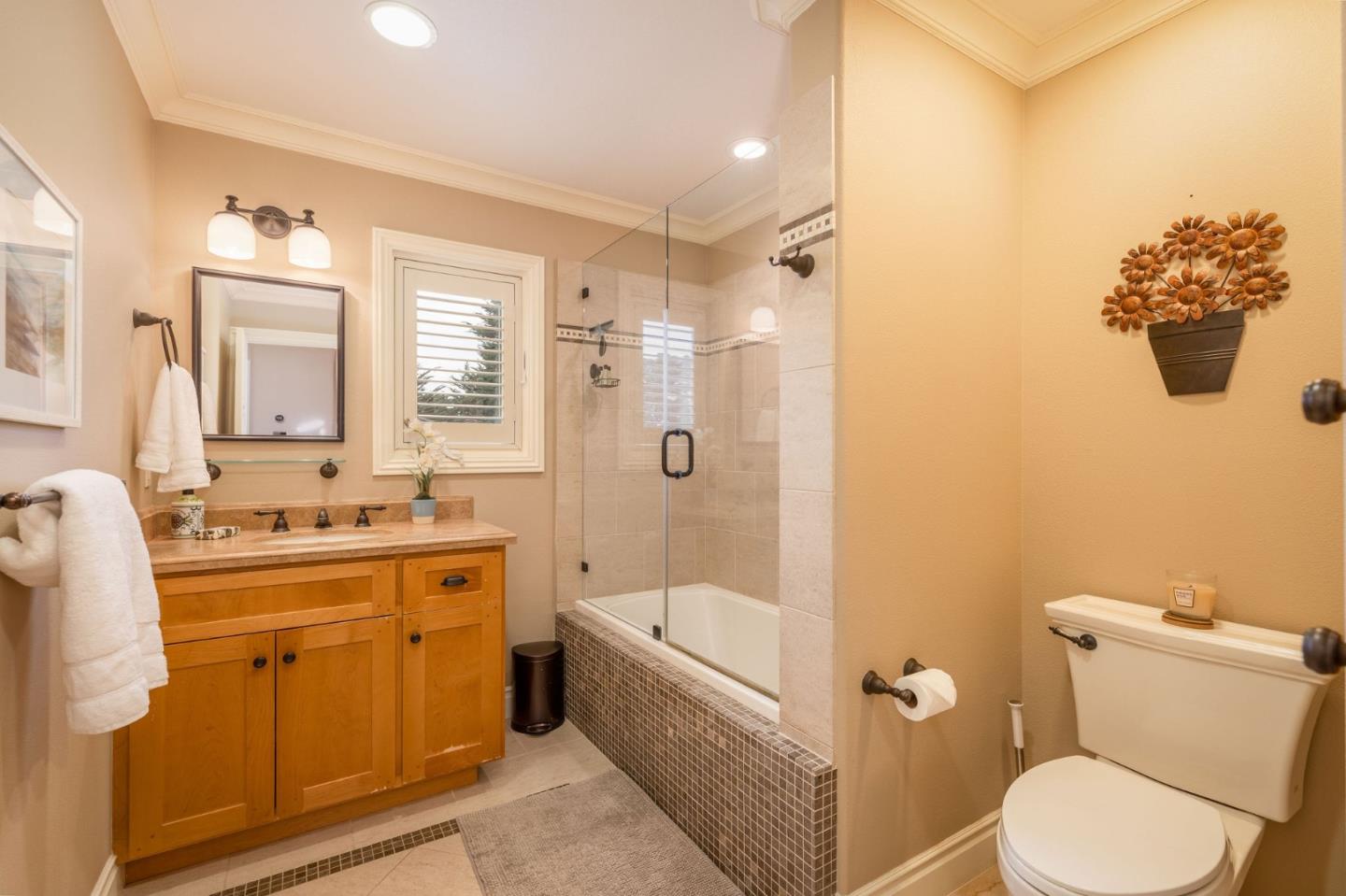 2107 Winged Foot Road Half Moon Bay, CA 94019 - Photo 20 of 29 a bathroom with a sink a toilet and shower