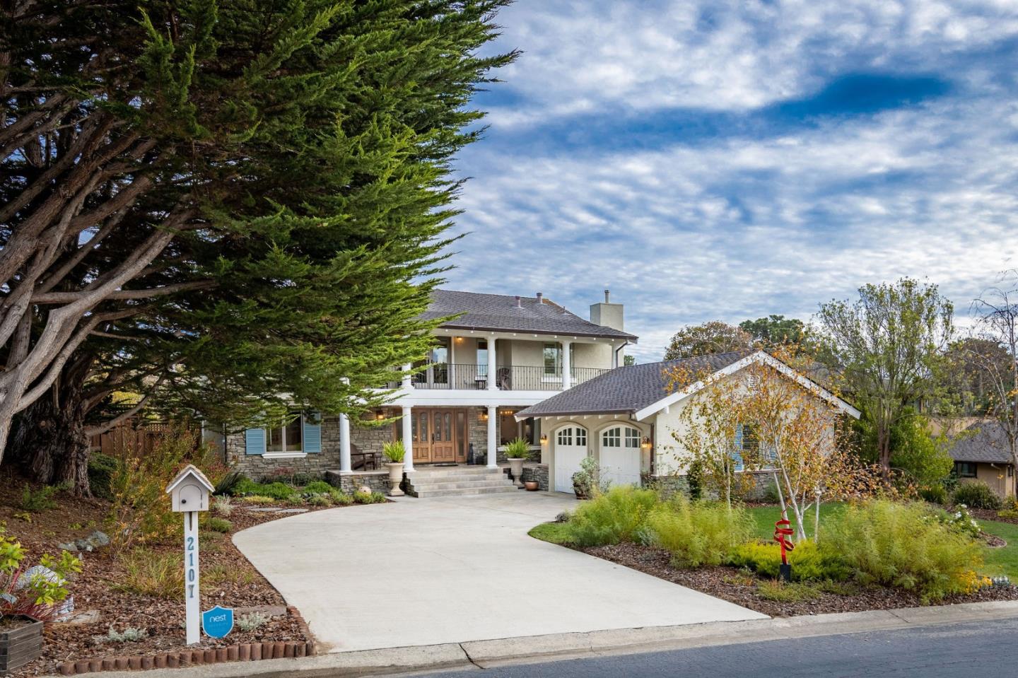 2107 Winged Foot Road Half Moon Bay, CA 94019 - Photo 2 of 29 a front view of a house with a garden