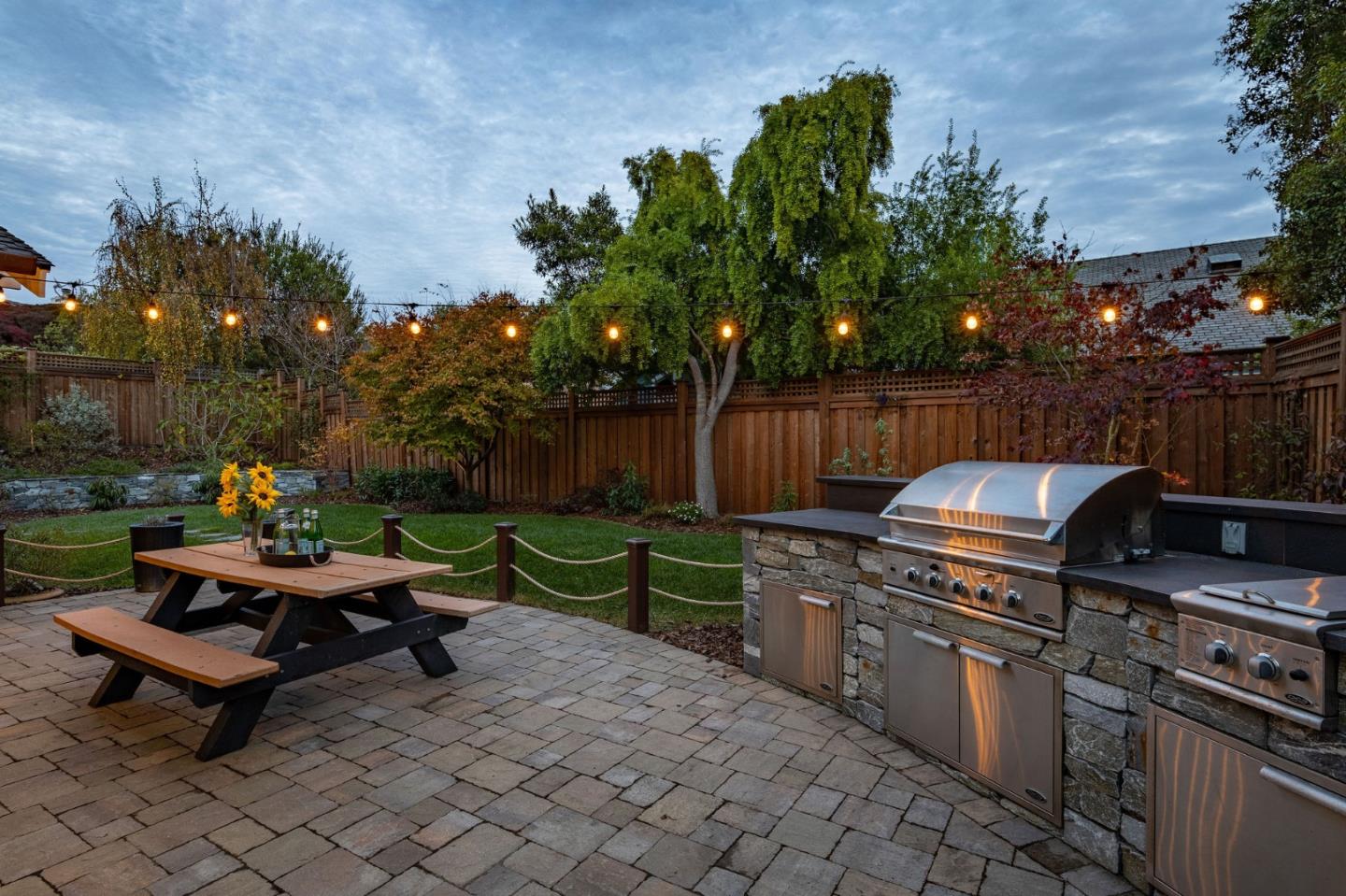 2107 Winged Foot Road Half Moon Bay, CA 94019 - Photo 25 of 29 a outdoor space with lots of potted plants and a bench