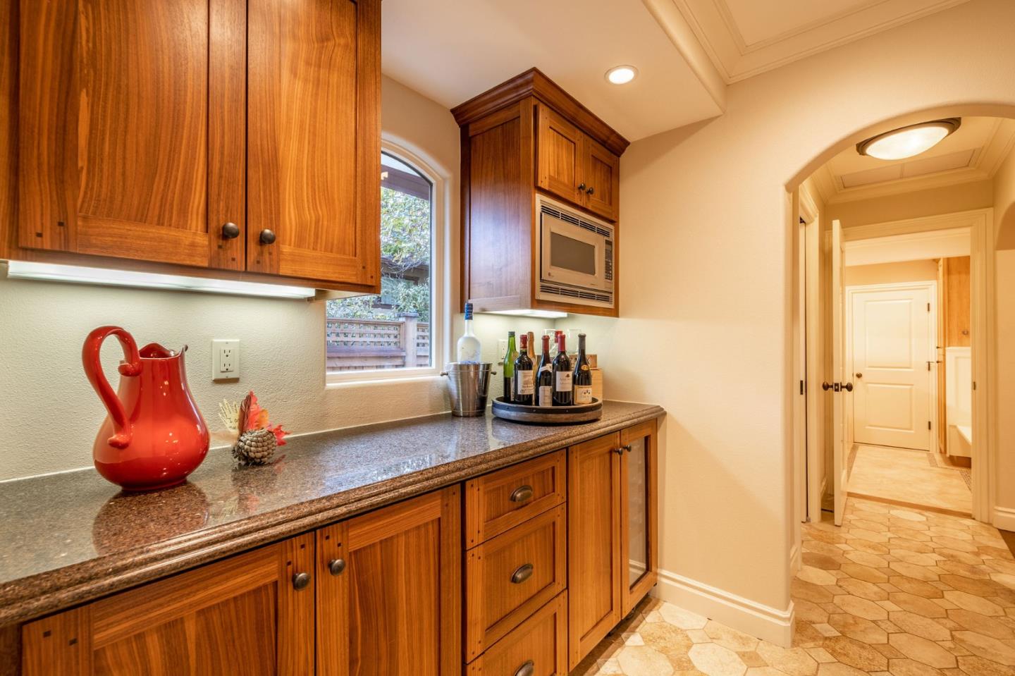 2107 Winged Foot Road Half Moon Bay, CA 94019 - Photo 10 of 29 a kitchen with stainless steel appliances granite countertop a sink a cabinets and a wooden floor