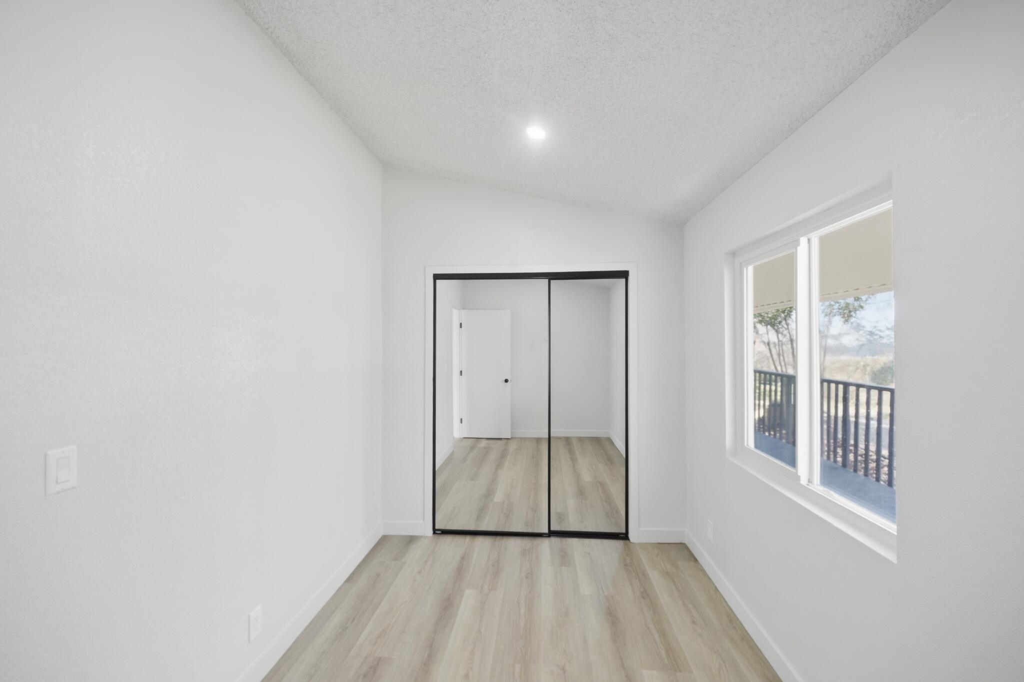 15181 Van Buren Boulevard, Unit 102 Riverside, CA 92504 - Photo 15 of 29 a view of an empty room and window