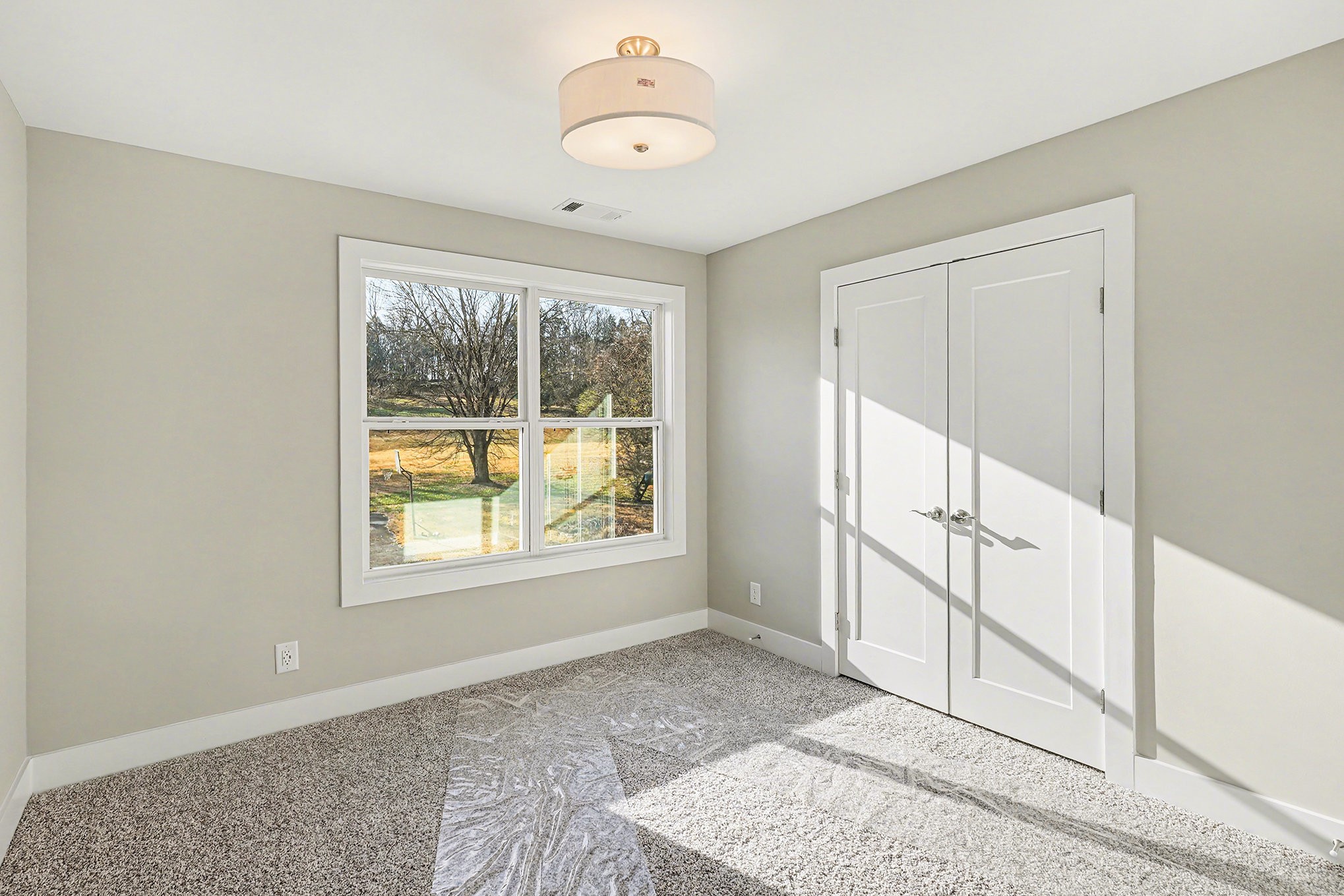 412 Harsh Lane Castalian Springs, TN 37031 - Photo 28 of 36 an empty room with windows and closet