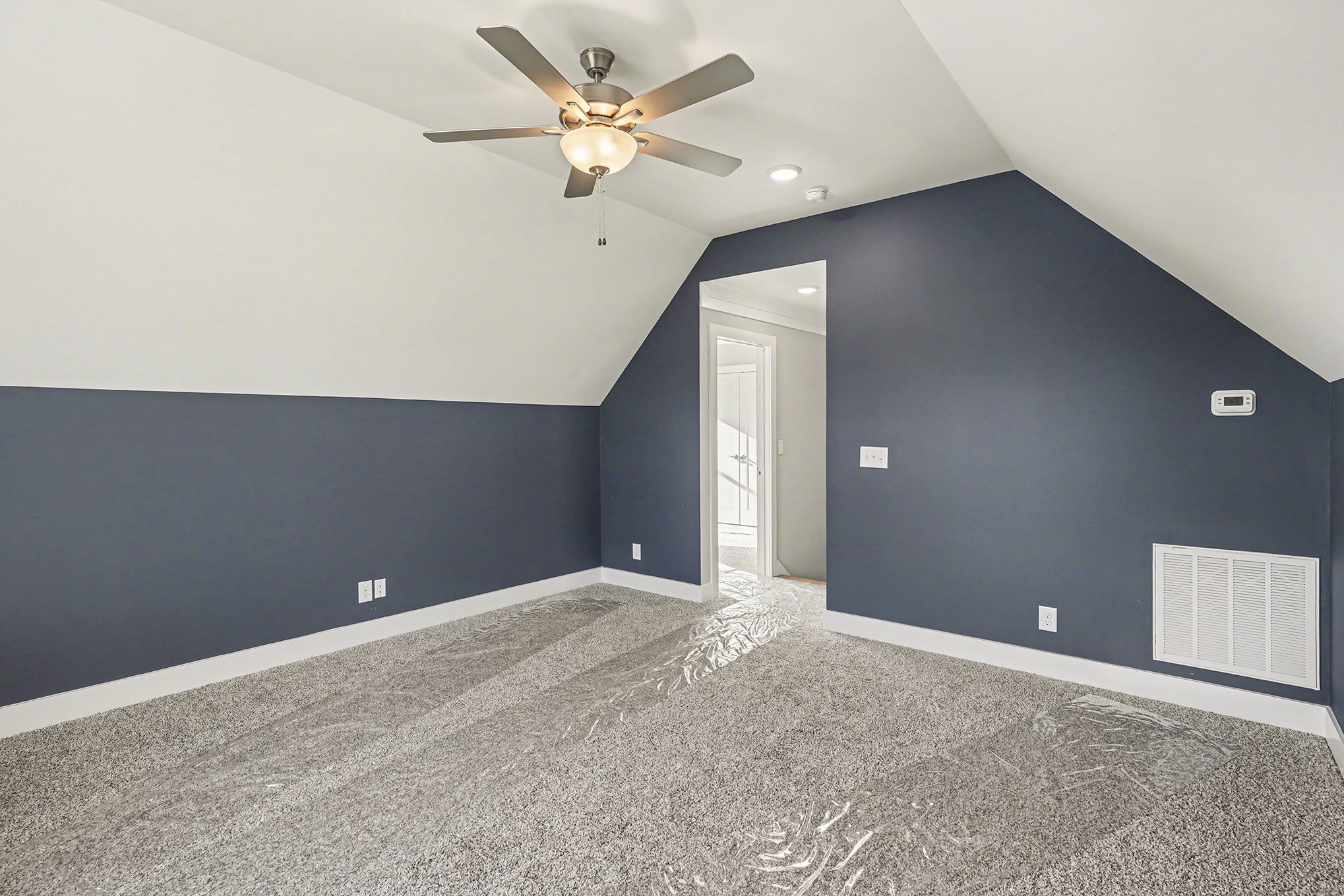 412 Harsh Lane Castalian Springs, TN 37031 - Photo 32 of 36 a view of an empty room with a ceiling fan