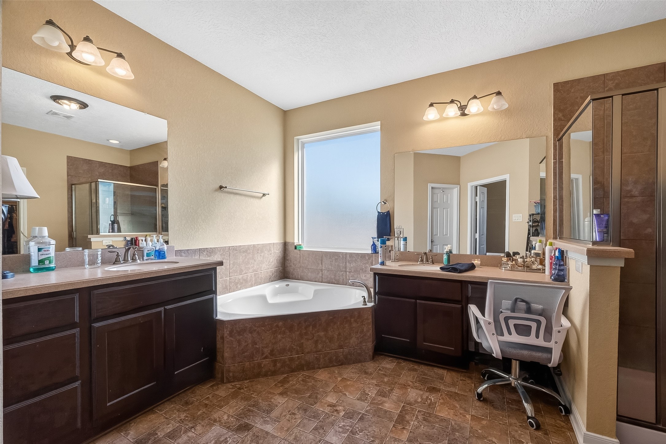 3418 Barbers Hill Road Highlands, TX 77562 - Photo 32 of 50 a large bathroom with a double vanity sink and mirror