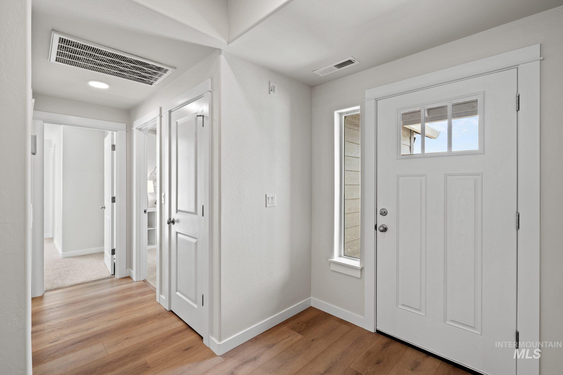 868 Adamite Road Kimberly, ID 83341 - Photo 13 of 22 Entrance foyer featuring baseboards and light wood-style floors