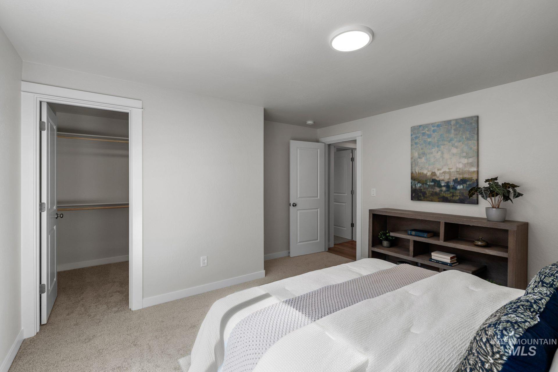 868 Adamite Road Kimberly, ID 83341 - Photo 3 of 22 Bedroom featuring light colored carpet and a spacious closet