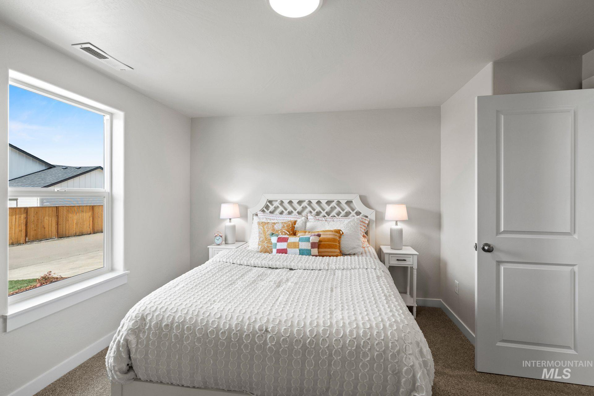 868 Adamite Road Kimberly, ID 83341 - Photo 8 of 22 Bedroom featuring dark carpet and baseboards