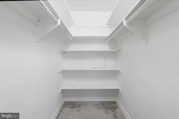 a view of an empty walk in closet