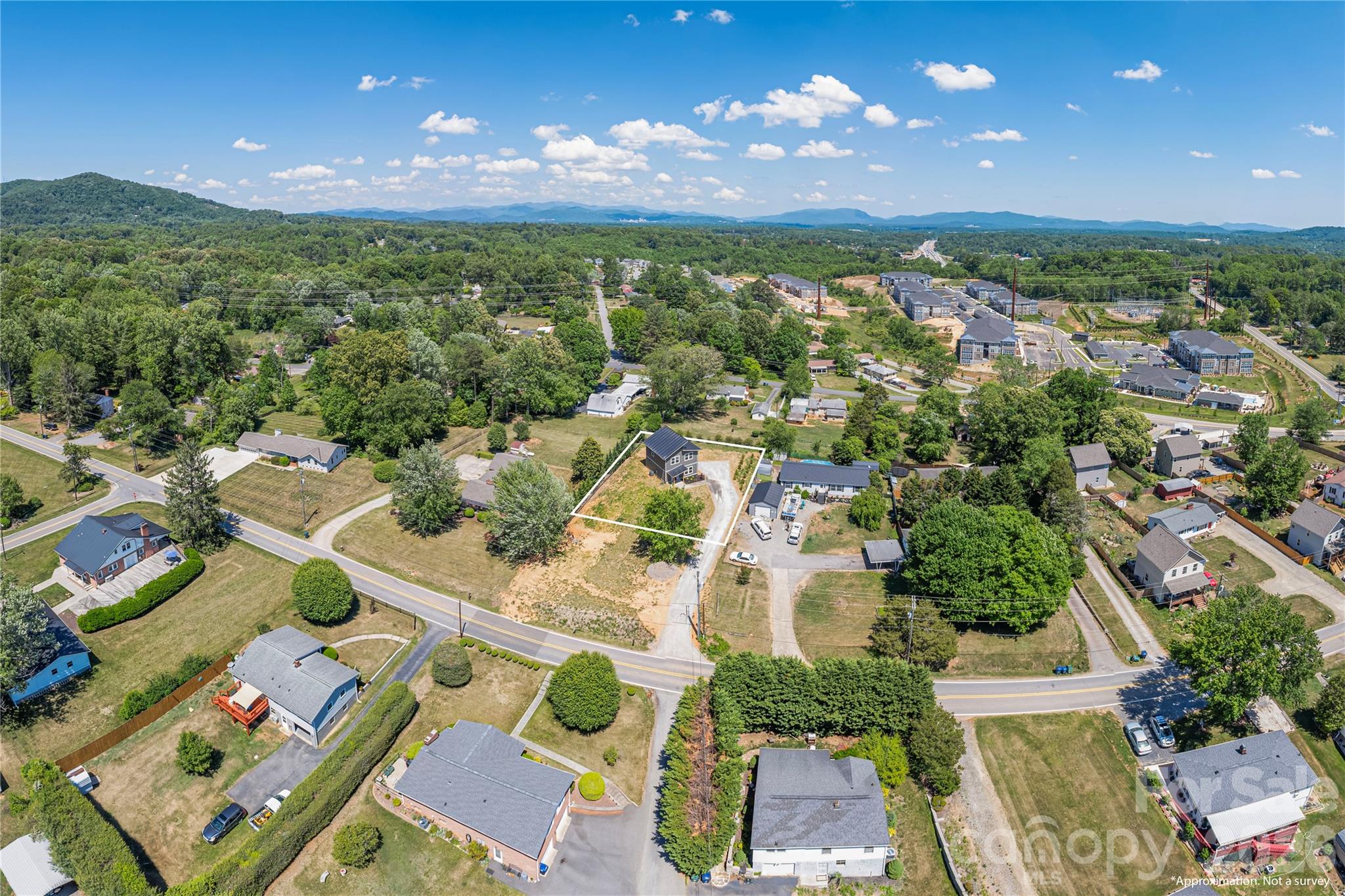 32 Oak Hill Road Candler, NC 28715 - Photo 29 of 29 an aerial view of residential houses with outdoor space