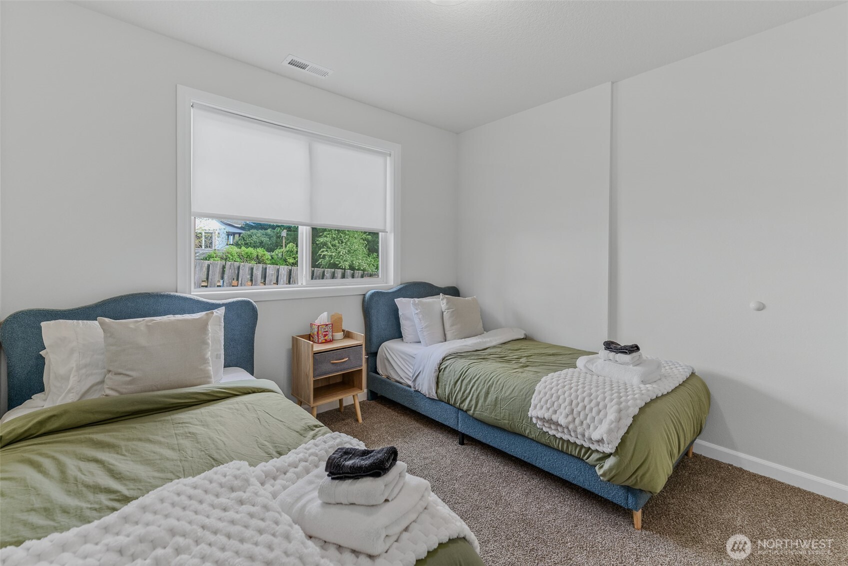 461 Northwest Jefferson Street Stevenson, WA 98648 - Photo 15 of 38 a bedroom with two beds and a large window