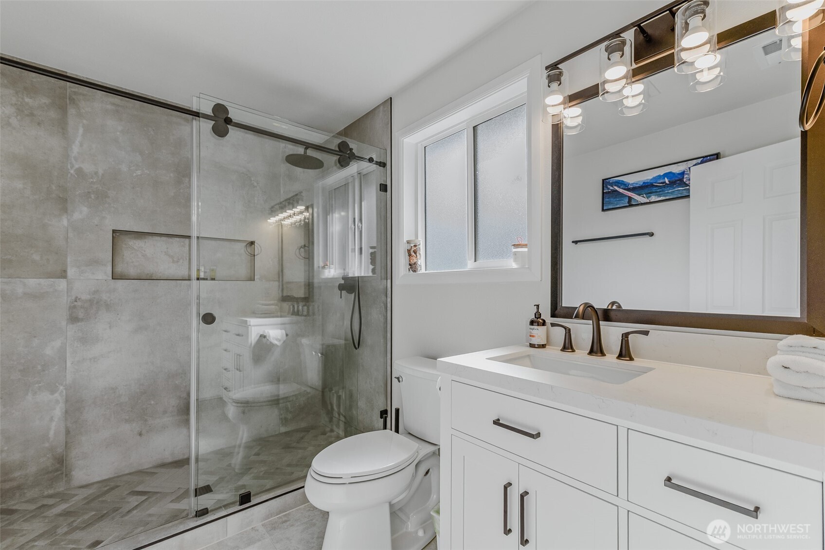 461 Northwest Jefferson Street Stevenson, WA 98648 - Photo 18 of 38 a bathroom with a shower sink vanity and toilet