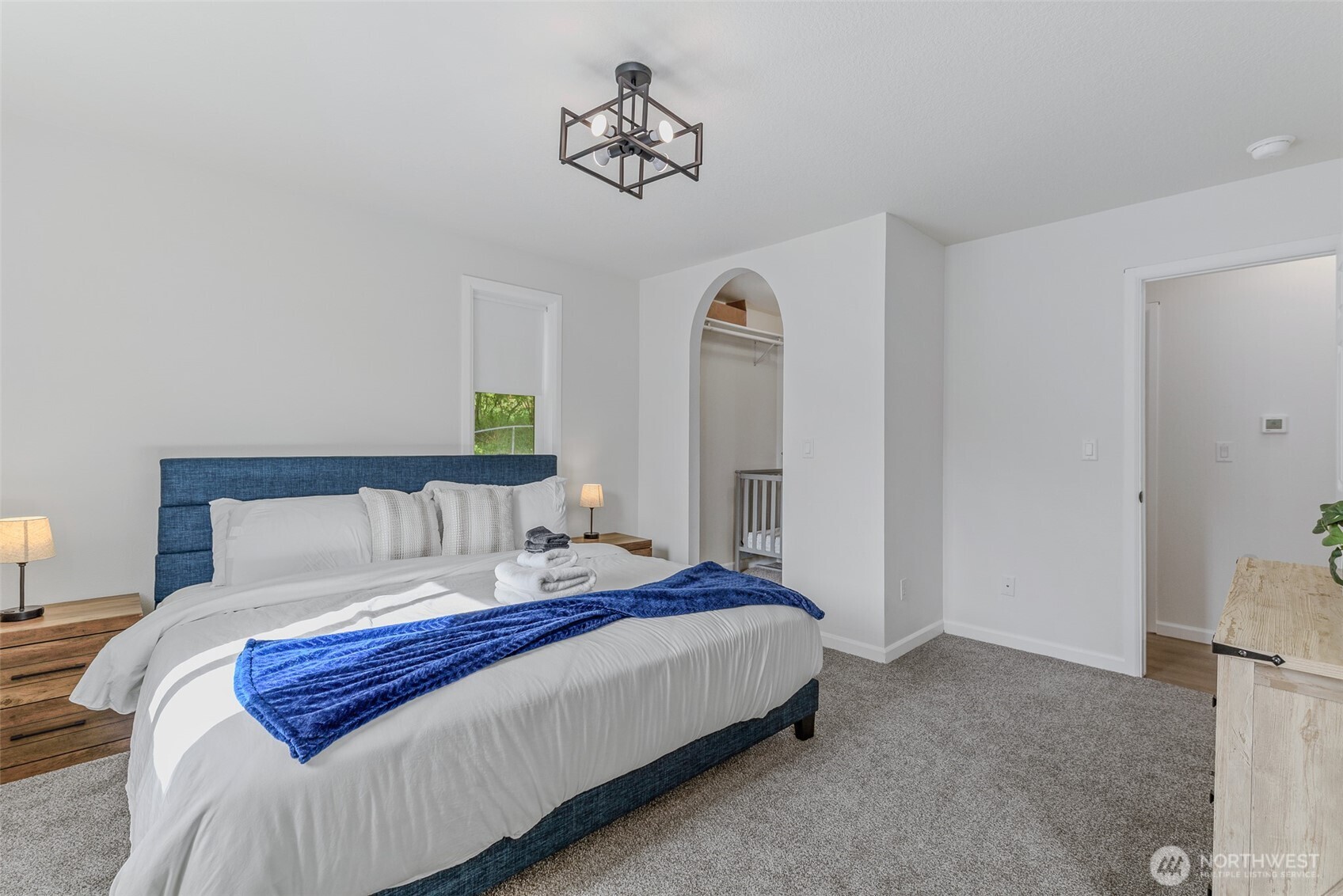 461 Northwest Jefferson Street Stevenson, WA 98648 - Photo 20 of 38 a bedroom with a bed and a painting on the wall
