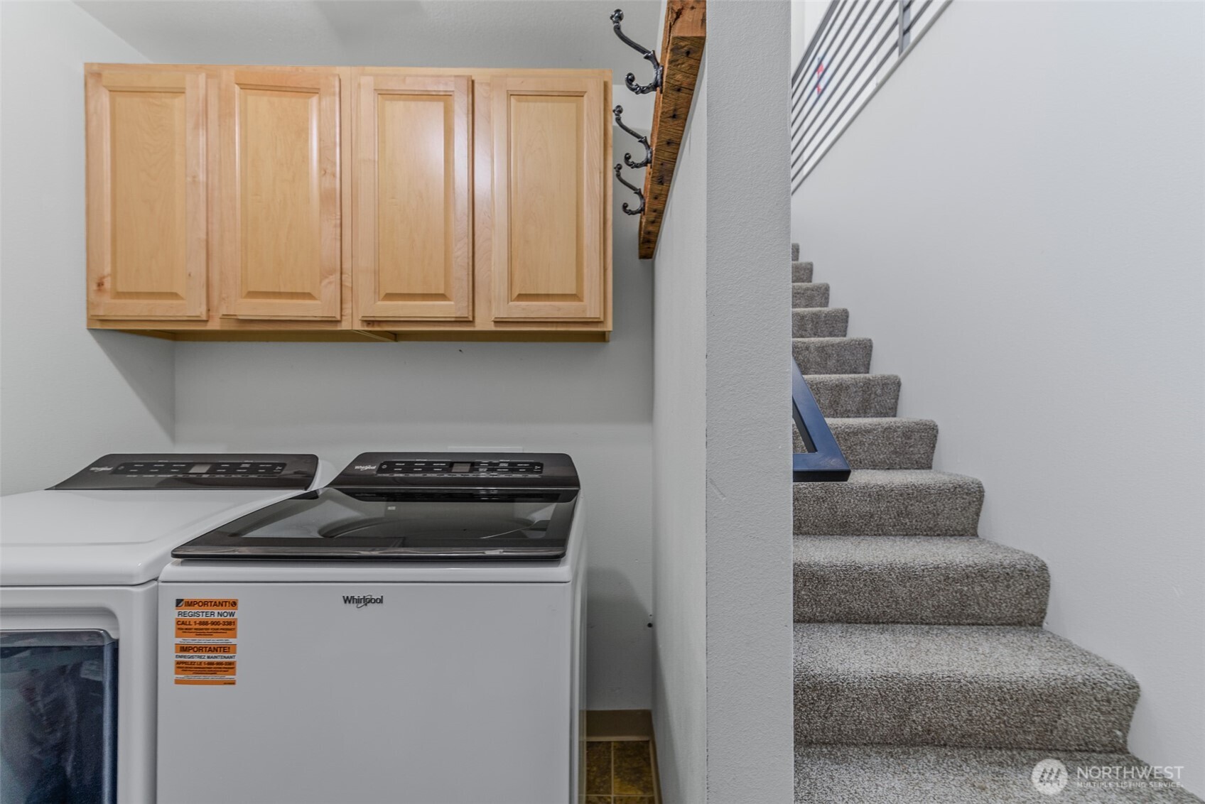 461 Northwest Jefferson Street Stevenson, WA 98648 - Photo 31 of 38 a kitchen with a refrigerator and white cabinets