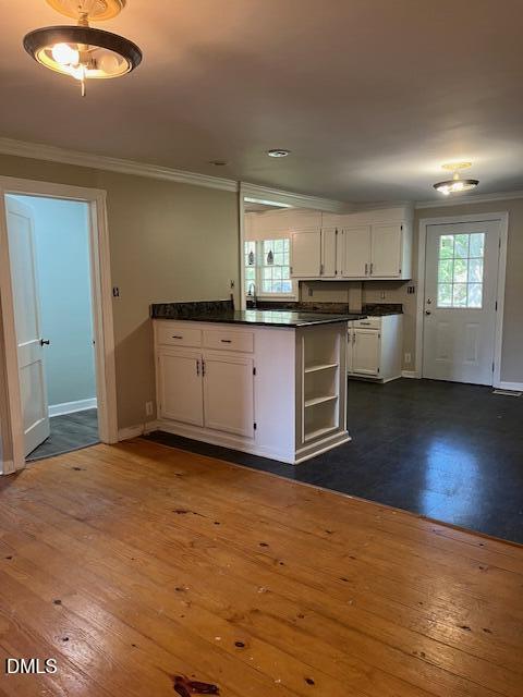 6663 Harold Obrien Road Oxford, NC 27565 - Photo 14 of 41 a kitchen with stainless steel appliances granite countertop a sink cabinets and wooden floor