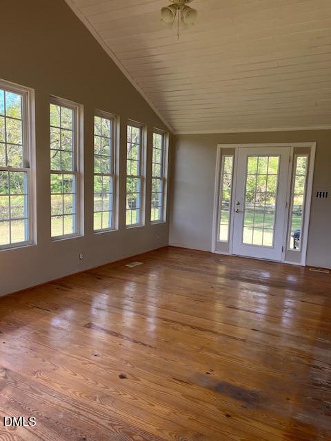 6663 Harold Obrien Road Oxford, NC 27565 - Photo 20 of 41 an empty room with wooden floor and windows