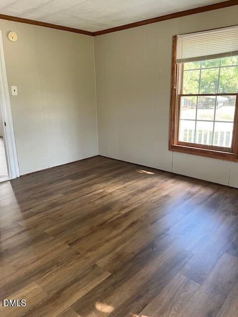 6663 Harold Obrien Road Oxford, NC 27565 - Photo 31 of 41 a view of an empty room with wooden floor and a window