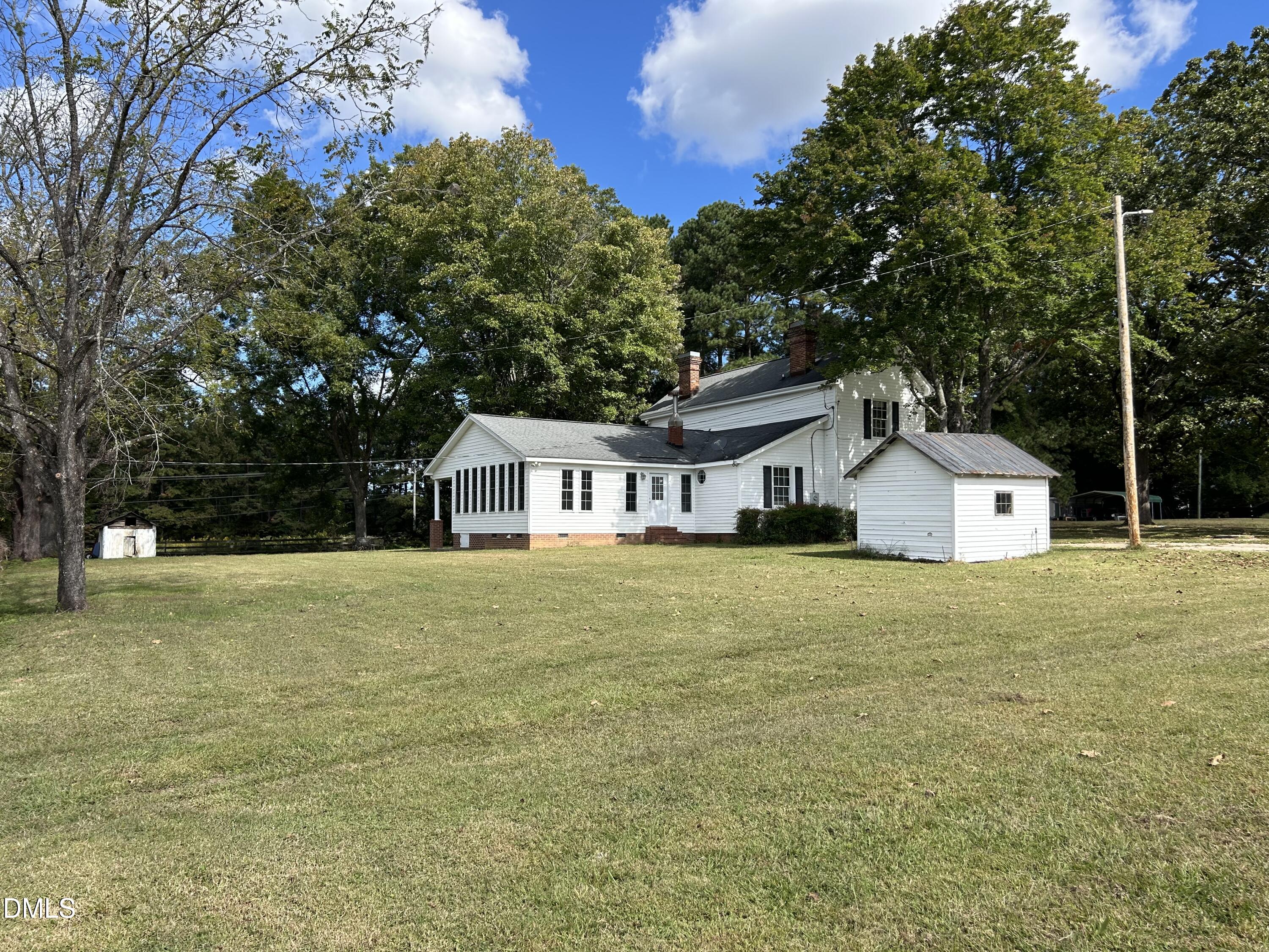 6663 Harold Obrien Road Oxford, NC 27565 - Photo 37 of 41 a front view of a house with a yard and trees