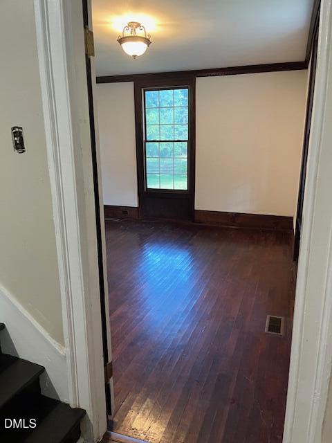 6663 Harold Obrien Road Oxford, NC 27565 - Photo 4 of 41 an empty room with wooden floor and windows