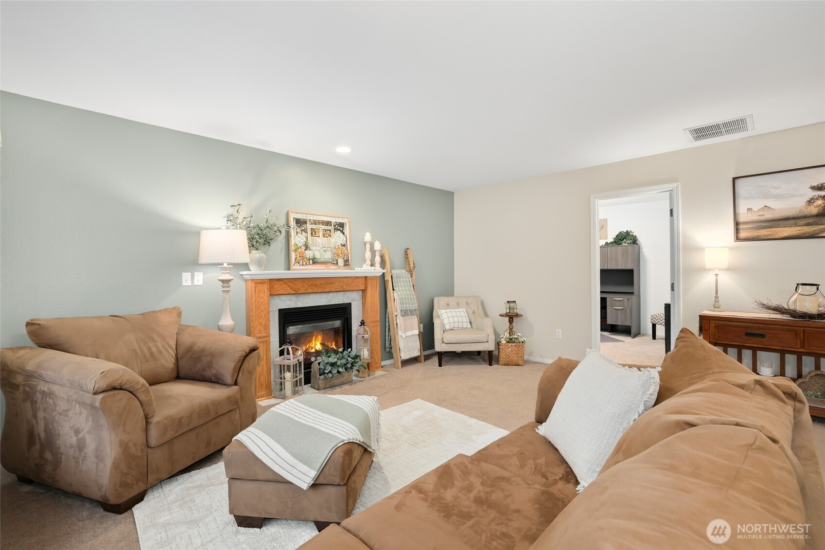 12722 247th Street East Graham, WA 98338 - Photo 14 of 40 a living room with furniture and a fireplace