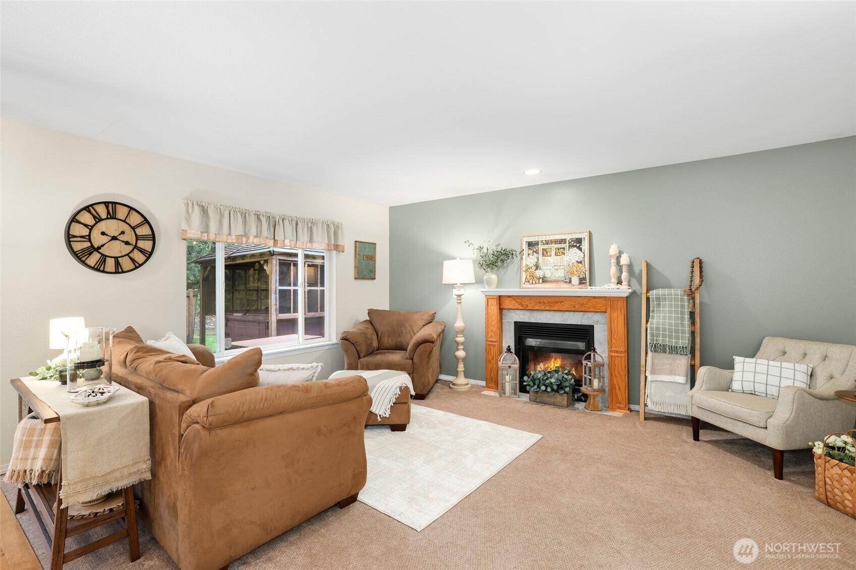 12722 247th Street East Graham, WA 98338 - Photo 15 of 40 a living room with furniture and a fireplace