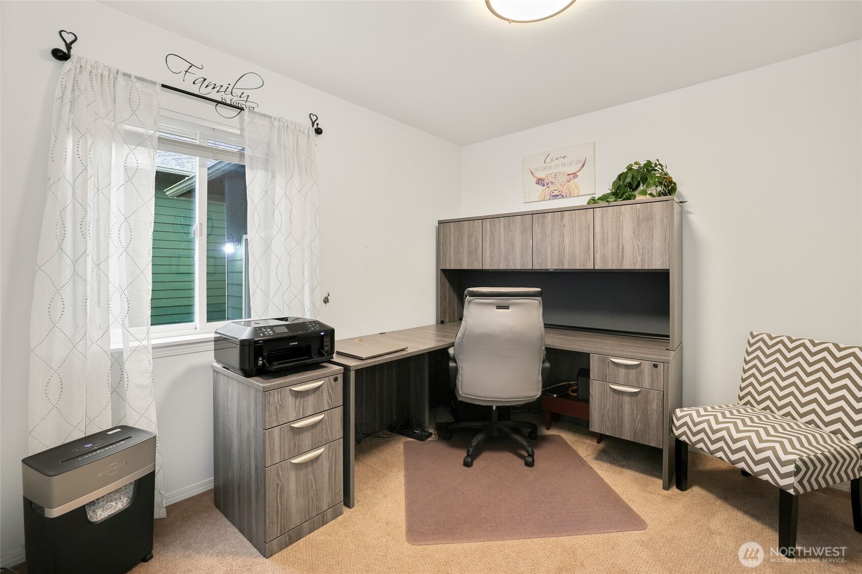 12722 247th Street East Graham, WA 98338 - Photo 16 of 40 a living room with furniture a rug and a window