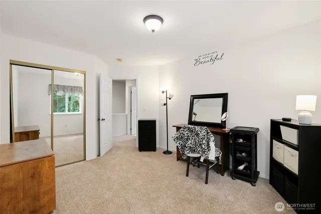 a bedroom with furniture and a dresser