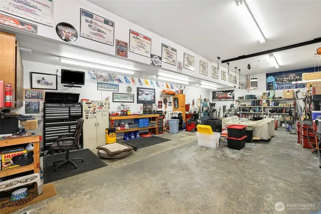 a garage with lots of furniture and clutter