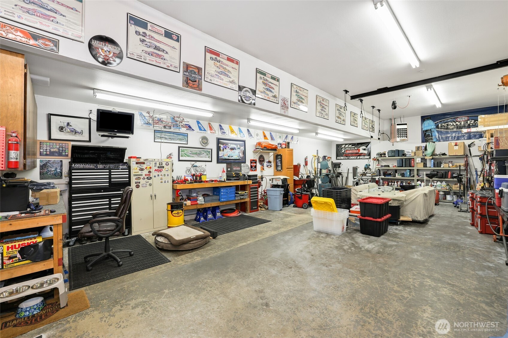 12722 247th Street East Graham, WA 98338 - Photo 30 of 40 a garage with lots of furniture and clutter