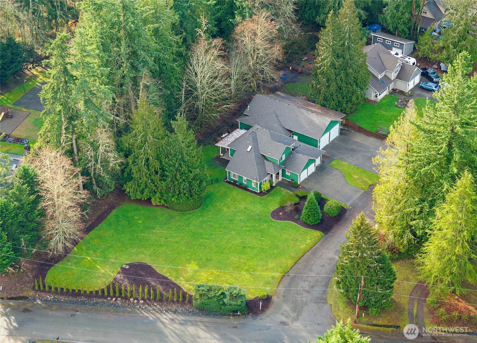 12722 247th Street East Graham, WA 98338 - Photo 31 of 40 an aerial view of a house with garden space and street view