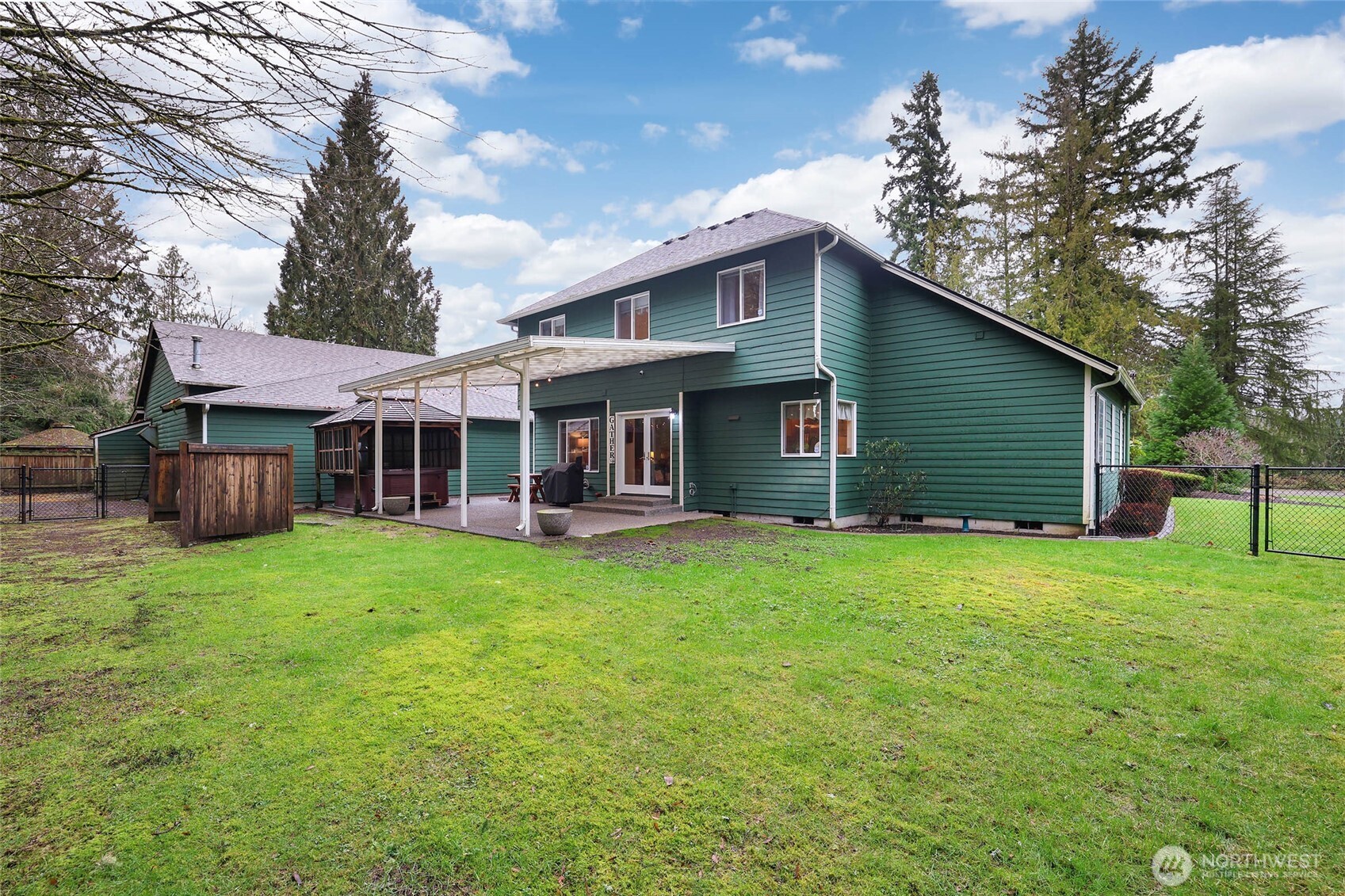 12722 247th Street East Graham, WA 98338 - Photo 33 of 40 a front view of a house with a garden