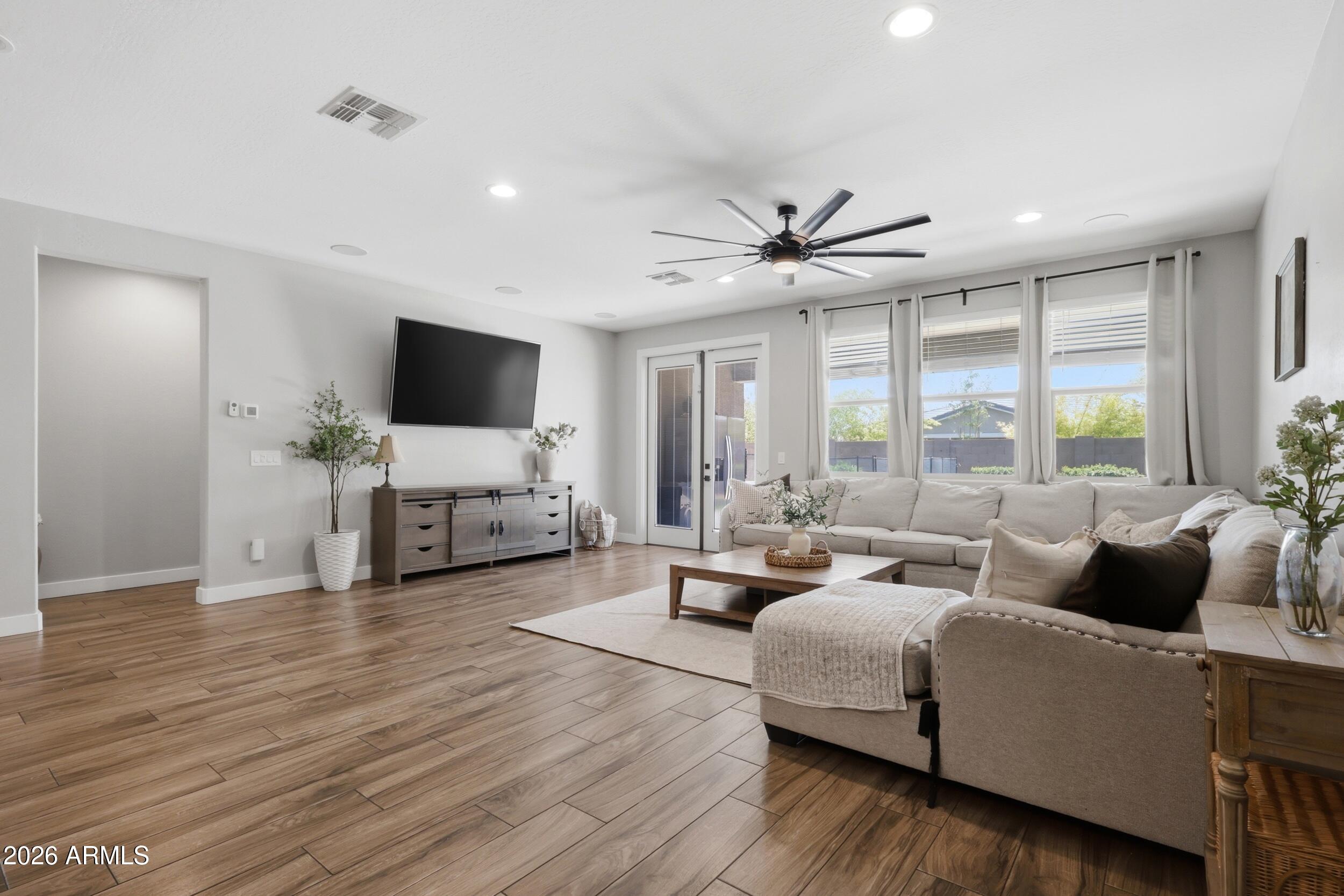 12517 West Lawrence Road Glendale, AZ 85307 - Photo 22 of 52 a living room with furniture and a large window