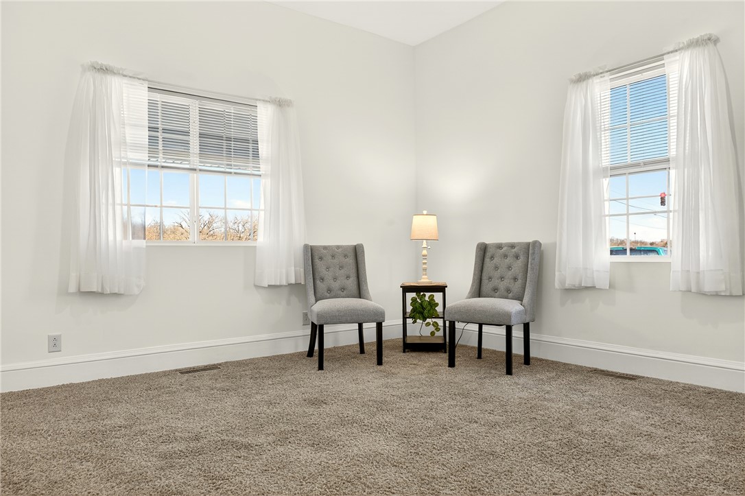 107 Riverside Drive Piqua, OH 45356 - Photo 6 of 69 This bright and airy room offers a welcoming ambiance for relaxation and comfort.