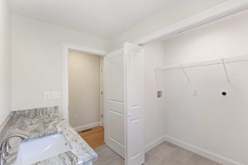 183 Rangeway Road Billerica, MA 01862 - Photo 6 of 14 a bathroom with a granite countertop sink and shower