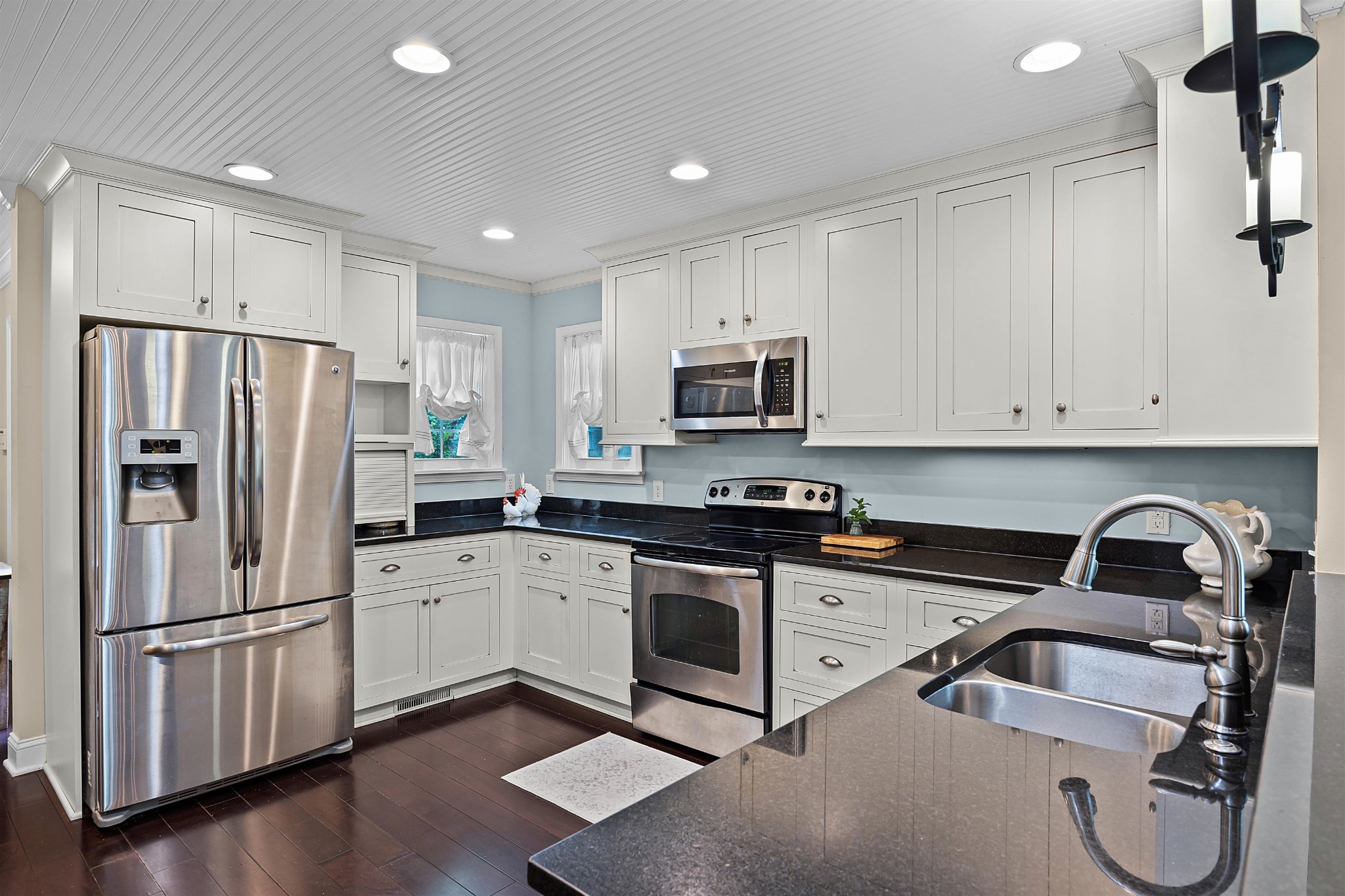 40 Vantage Pointe Counce, TN 38326 - Photo 7 of 25 a kitchen with a refrigerator sink and white cabinets