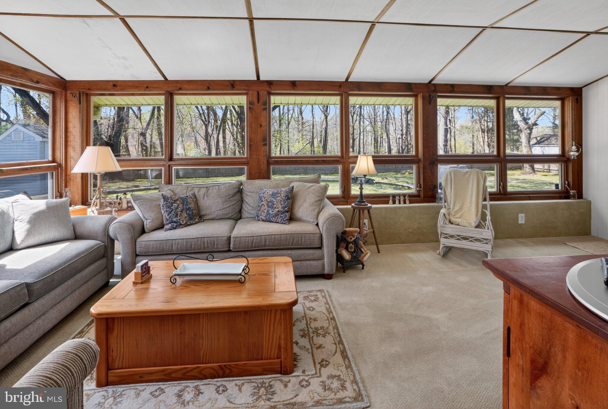 141 Parkview Road Stratford, NJ 08084 - Photo 10 of 48 Sunlit Florida room with wooded views.