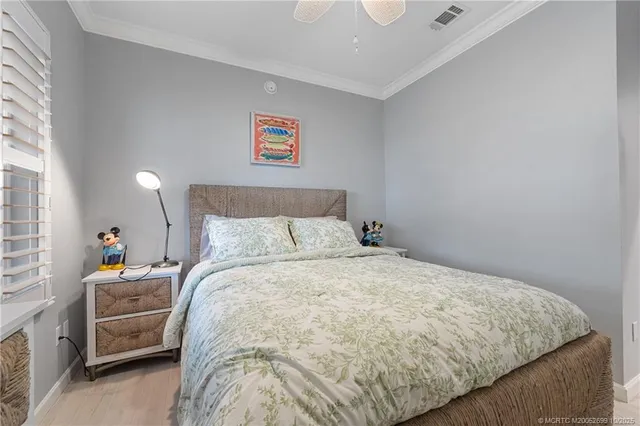 a bedroom with a bed and a cabinets