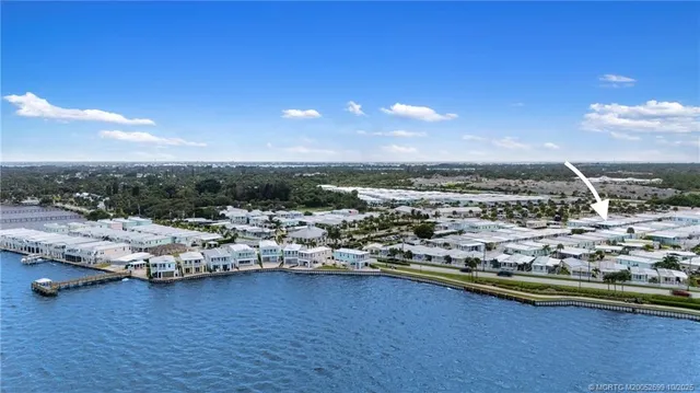 a view of a lake with boats and trees